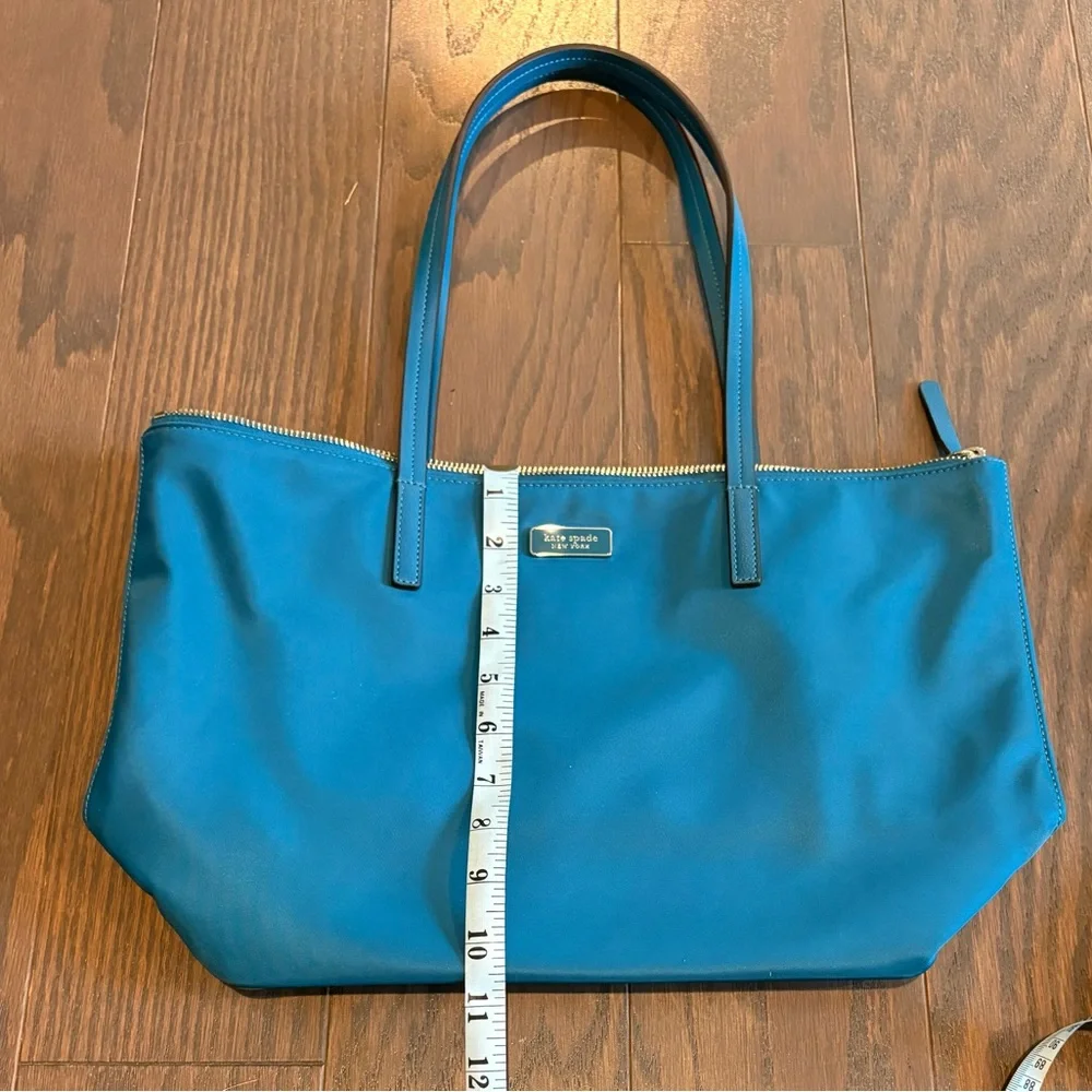 New kate spade teal nylon tote with gold-tone zipper.    Excellent condition.